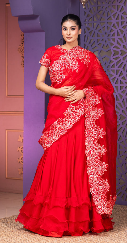 Red lehenga saree with  attached pallu  and blouse